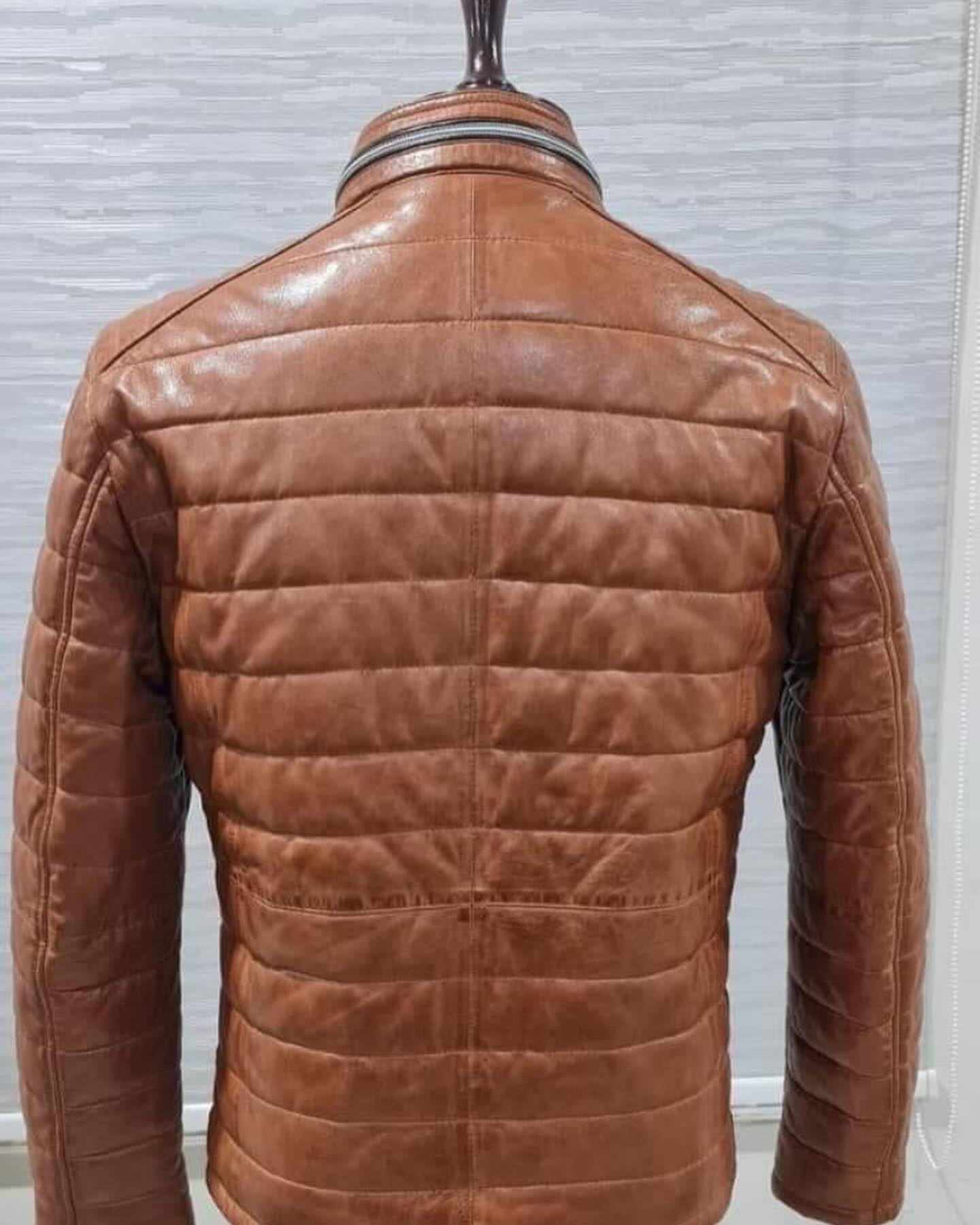 Genuine leather down jacket with press buttoned mandarin Collar